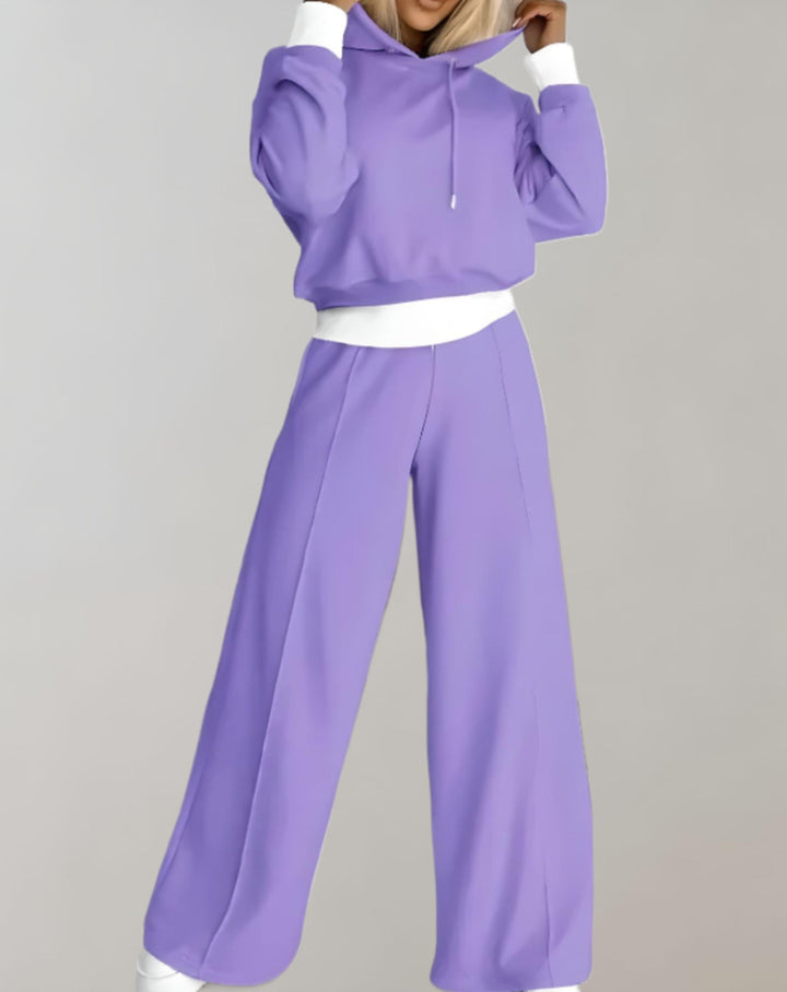 Woman wearing purple two-piece sweater and wide leg pants set
