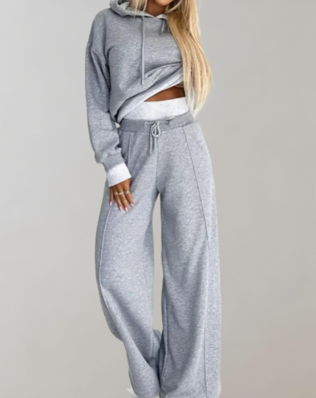 Woman wearing gray two-piece sweater and wide leg pants set