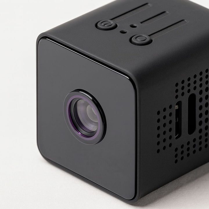 Outdoor wireless camera mounted securely under a home eaves protecting the entryway