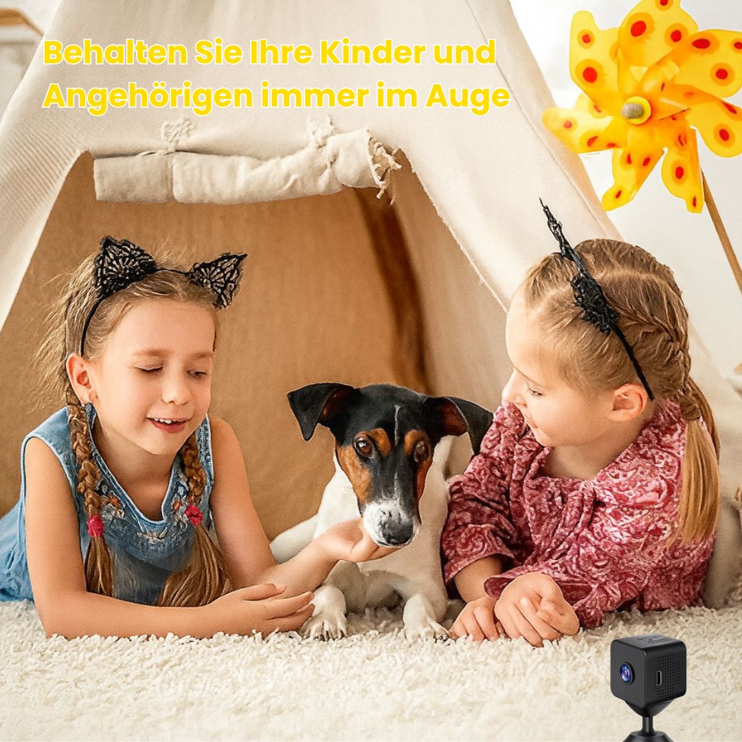 Mini security camera placed in a child-friendly indoor play area with children and pet