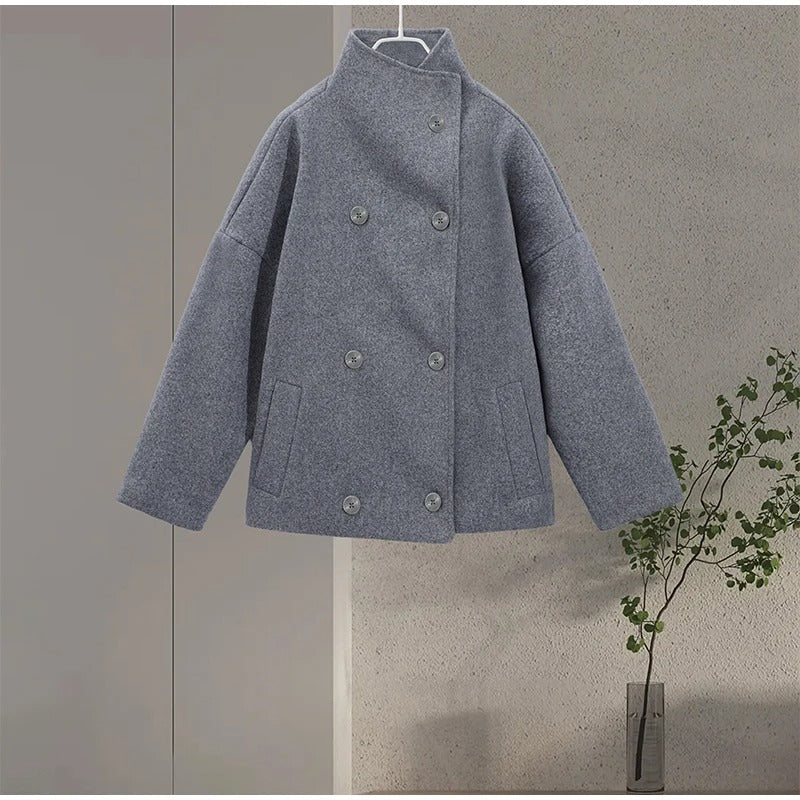 Womens double-breasted short coat showing button detail