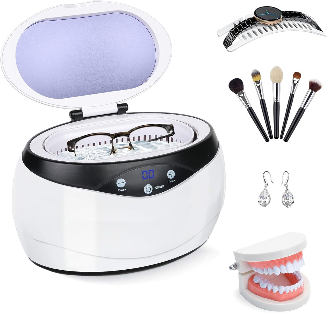 Ultrasonic jewelry cleaner with glasses inside the open white and black tank
