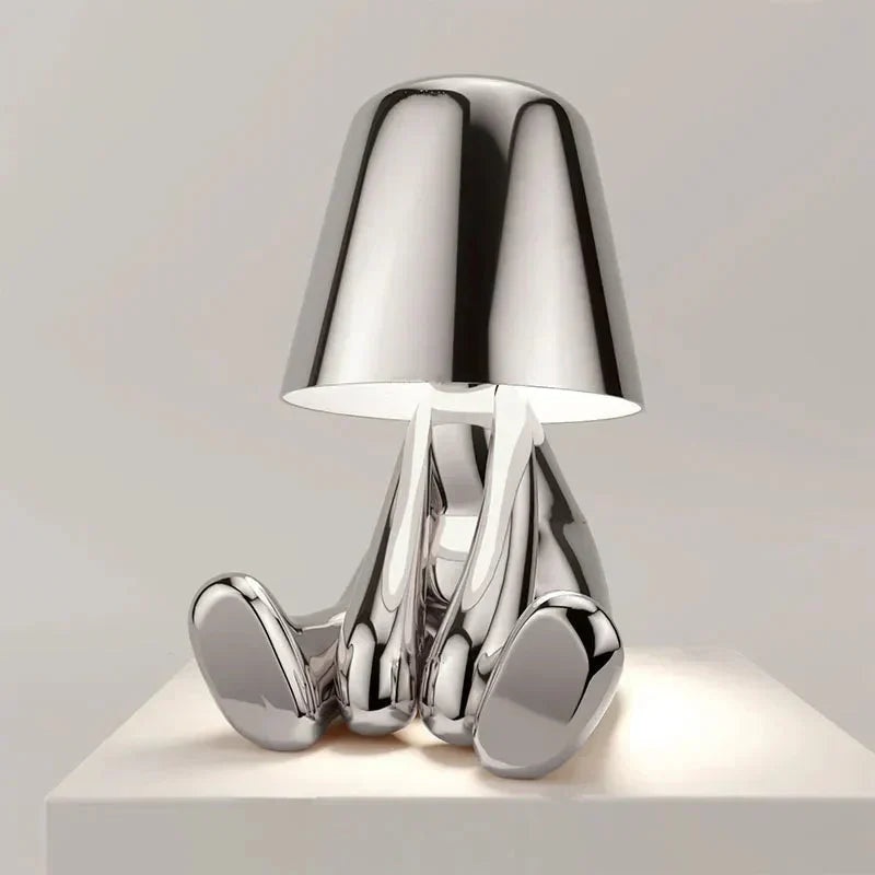 Rechargeable cordless lamp glowing warmly on a dining table