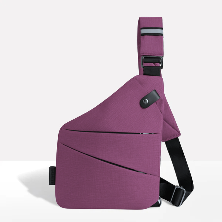 Side profile of the black anti-theft travel bag highlighting slim profile and durable material