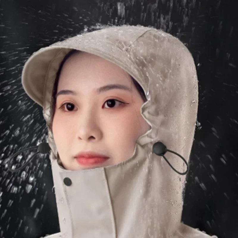 Unisex rain coat worn by a model, demonstrating loose fit and length