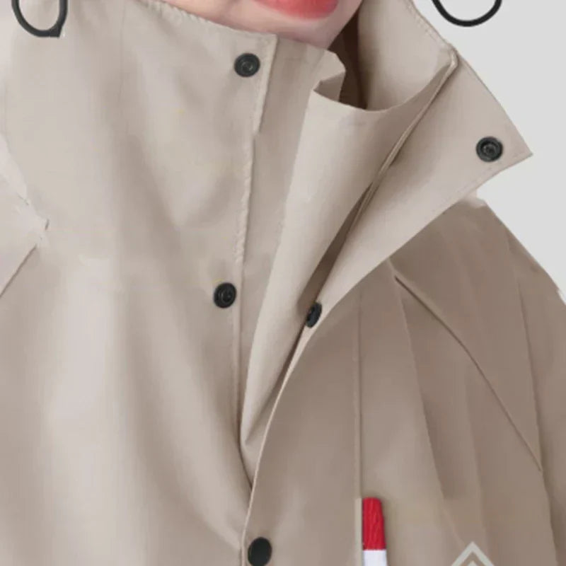 Detailed view of the adjustable hood and snap buttons on the waterproof jacket
