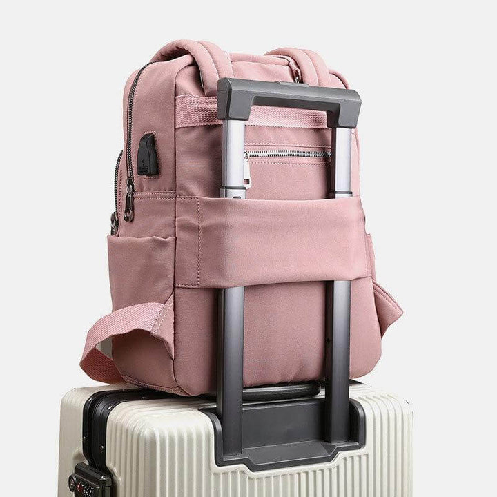 Black laptop bag worn by model demonstrating daily commuting style