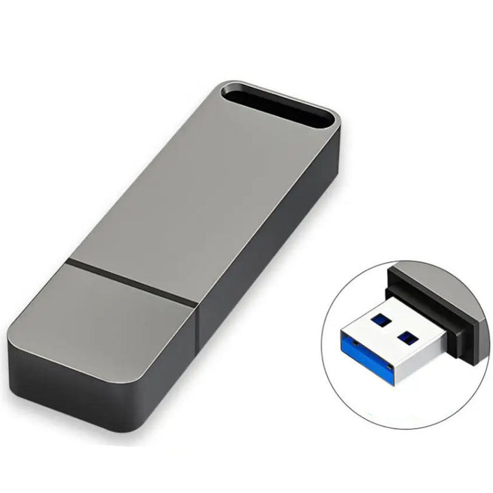 Grey metal USB flash drive with a close-up inset of the USB connector port