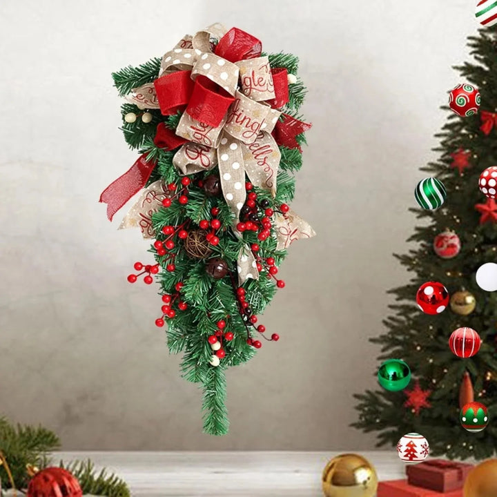 Upside down Christmas tree door swag showcased with holiday decorations