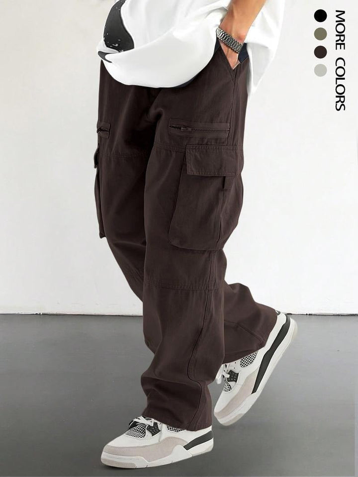 Man wearing brown urban utility cargo pants with multiple pockets
