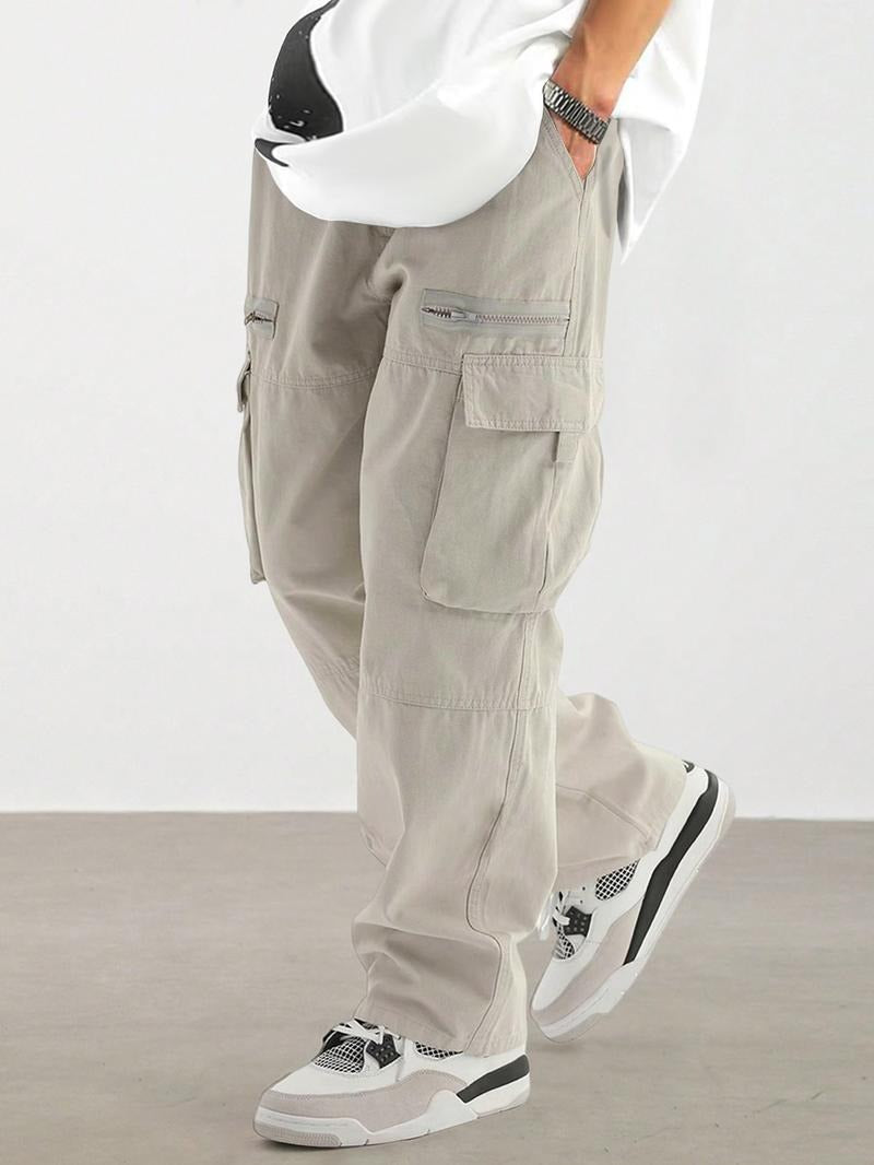 Man wearing light gray urban utility cargo pants with relaxed fit