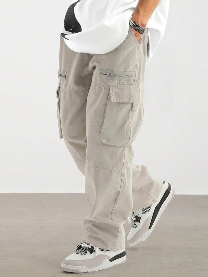 Man wearing light gray urban utility cargo pants with relaxed fit
