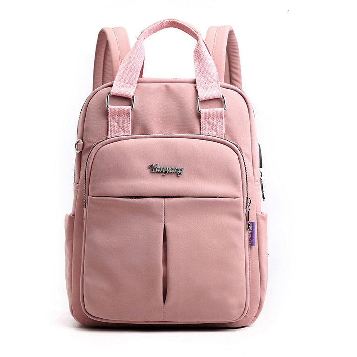 Model wearing the unisex commuter backpack in an urban travel setting