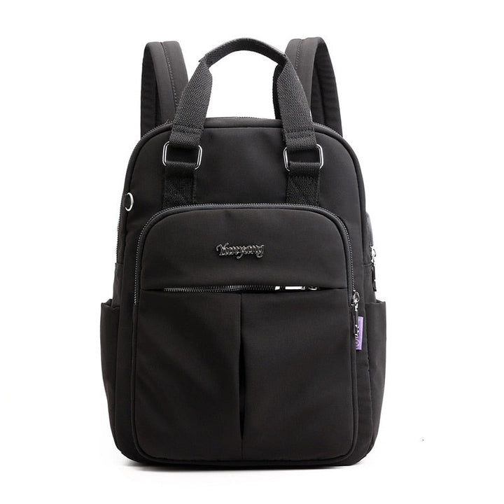Side profile of the water-resistant anti-theft travel backpack showing compact design