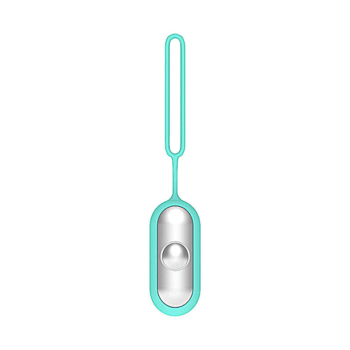 Portable handheld anxiety relief device with included accessories laid flat.