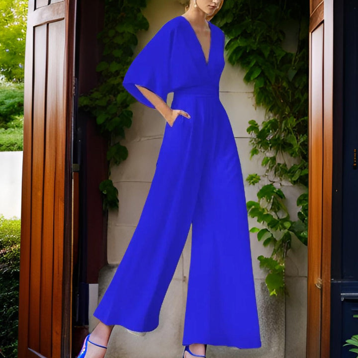 Elegant women's V-neck jumpsuit with three-quarter sleeves from side angle