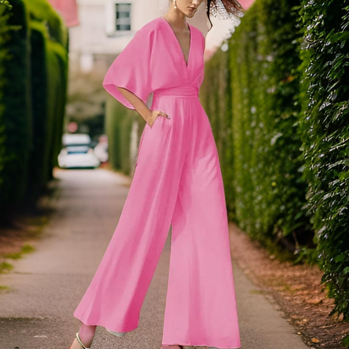 Back view of chic V-neck evening jumpsuit for women with wide leg design