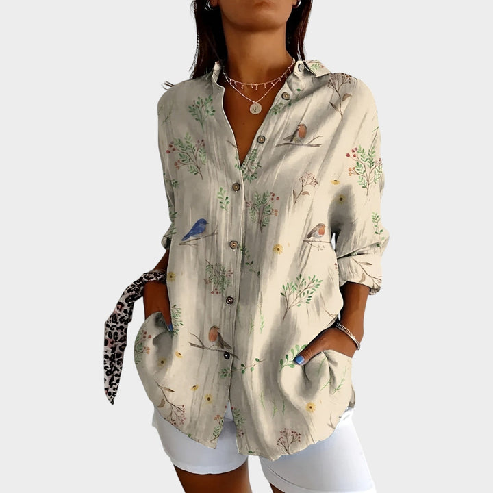 Women's printed button up blouse showcasing long sleeves and chic casual wear design