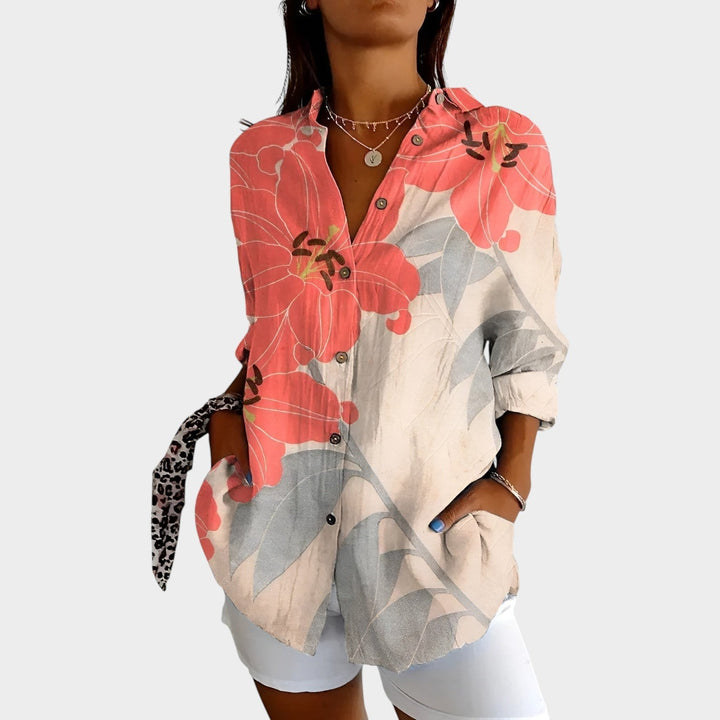 Casual wear button up top for women displayed on a hanger highlighting playful prints