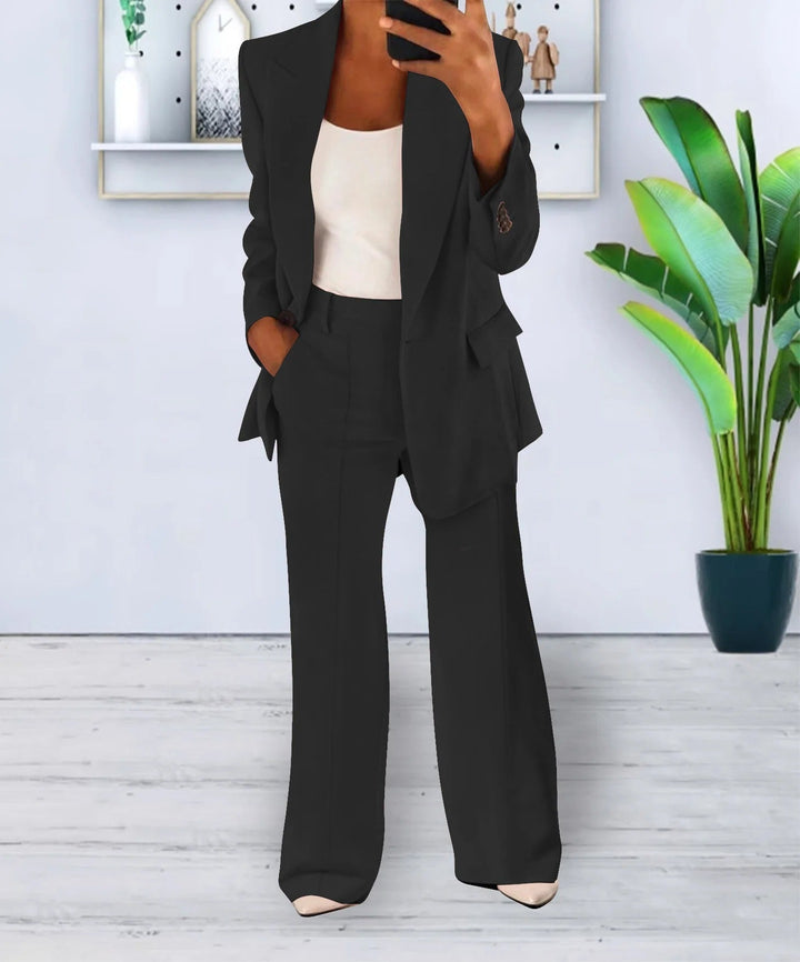 Woman wearing black tailored blazer and wide-leg pants suit set
