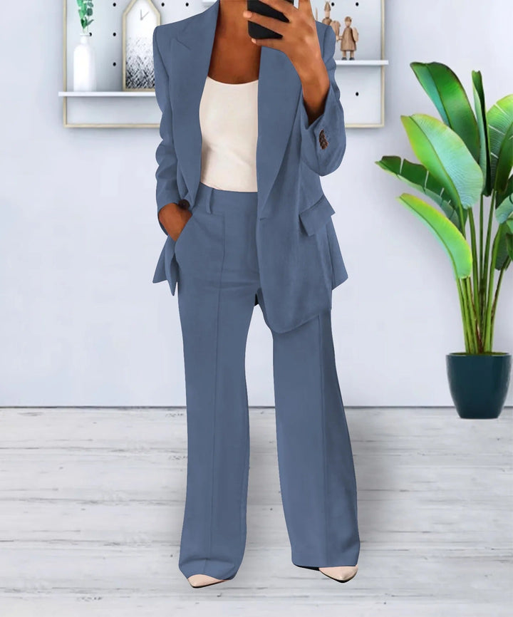 Woman wearing blue tailored blazer and wide-leg pants suit set