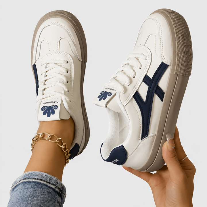 Women's orthopedic walking sneakers in blue and cream colorway shown from top angle