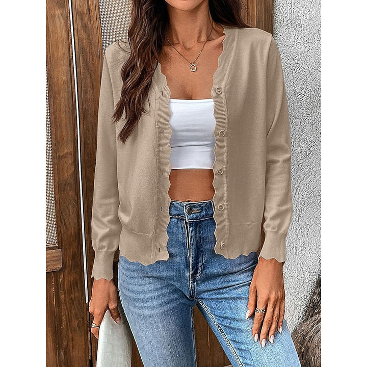 Textured fabric detail of soft womens sweater with button-front design