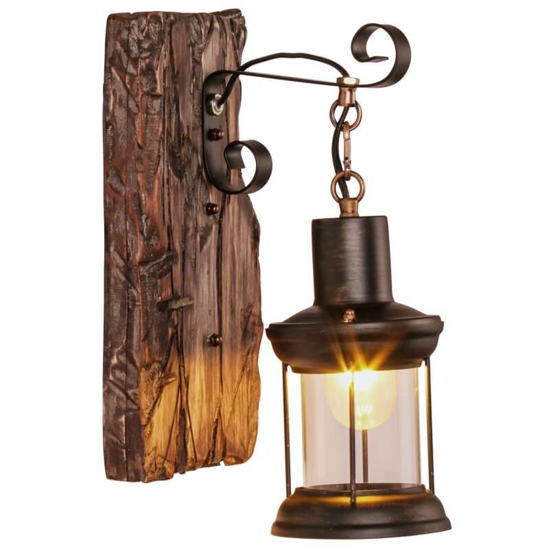 Rustic wooden base wall lamp with hanging glass lantern design lit up against a plain background