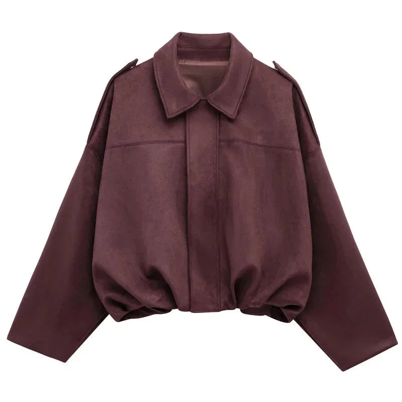 Flat lay of minimalist womens streetwear oversized bomber jacket