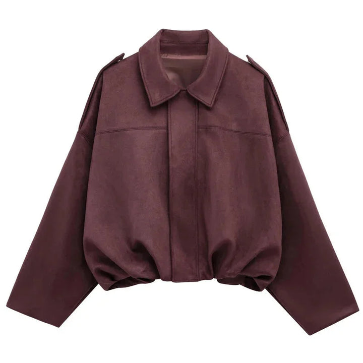 Flat lay of minimalist womens streetwear oversized bomber jacket