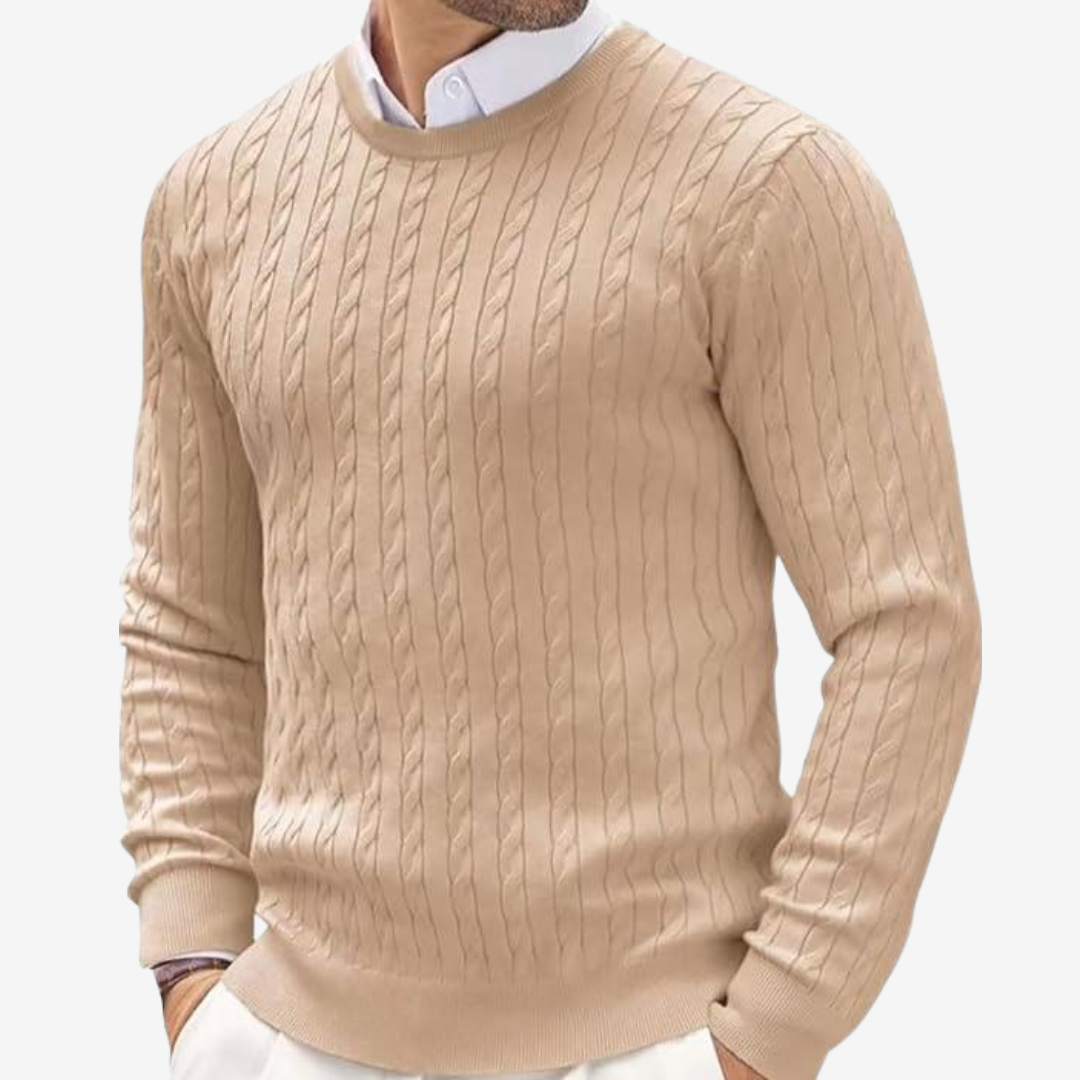 Close up of long sleeve mens cable knit sweater featuring textured pattern