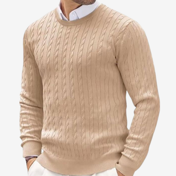 Close up of long sleeve mens cable knit sweater featuring textured pattern