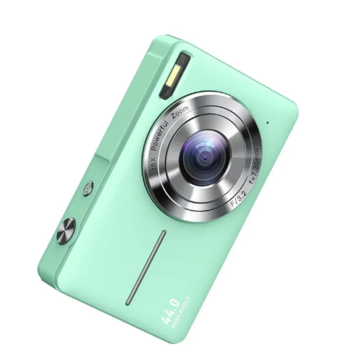 Close-up of the mint green PocketPix digital camera showcasing its lens and sleek finish