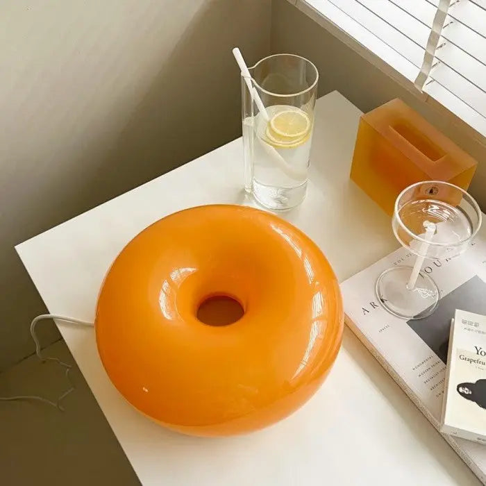 Interior styling with a modern orange accent lighting piece
