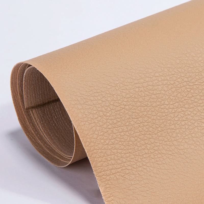 Roll of black leather repair patch showing grain texture and thickness