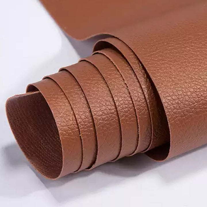 Close-up of rolled brown vinyl repair sheet for furniture restoration