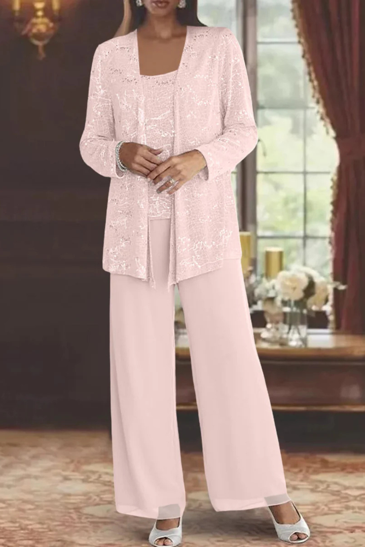 Close up of waistband and pleating details on the wide leg formal trousers