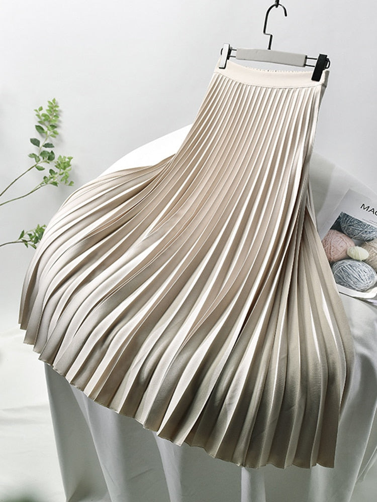 Beige high-waist pleated midi skirt hanging on a display