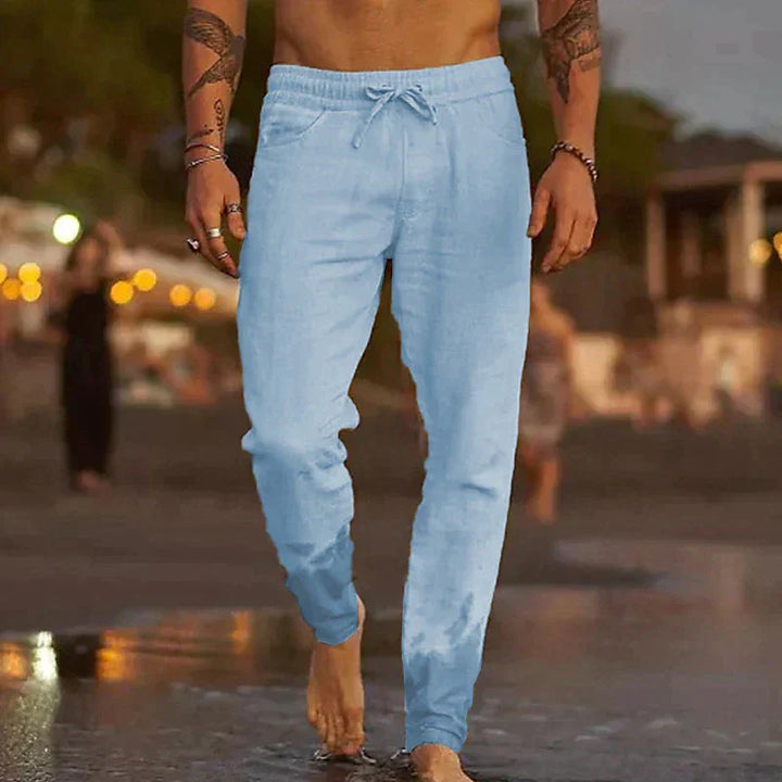 Side profile of breathable men's beach wear trousers in neutral tone