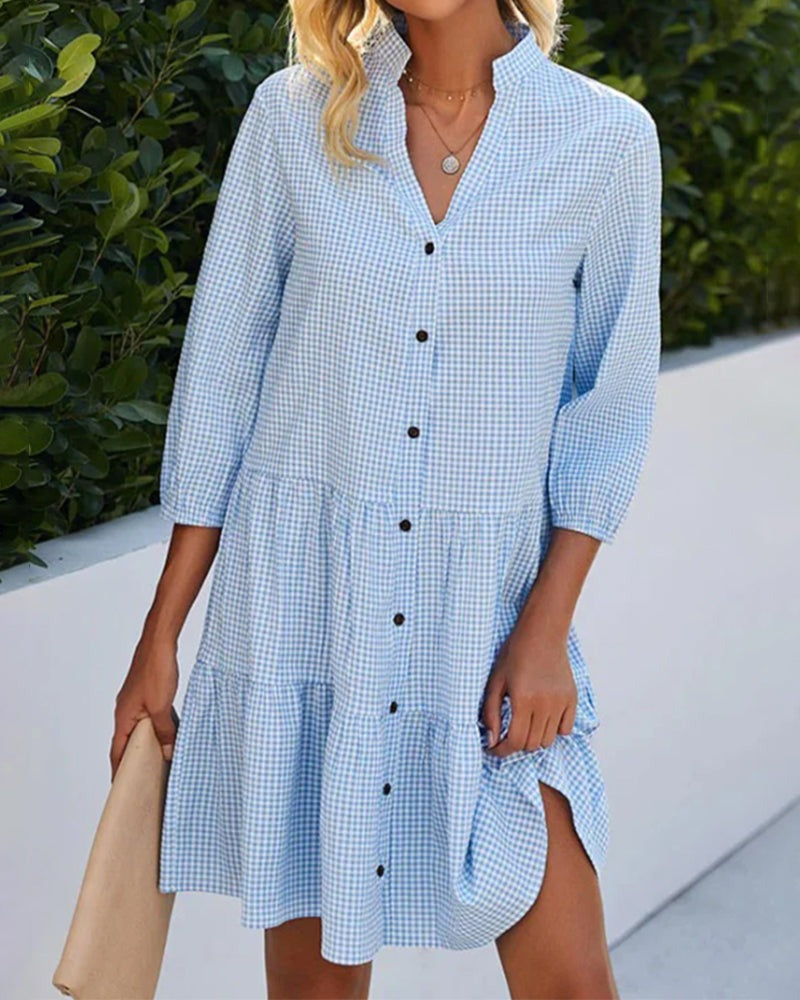 Full view of the tiered blue dress showcasing the flowy silhouette