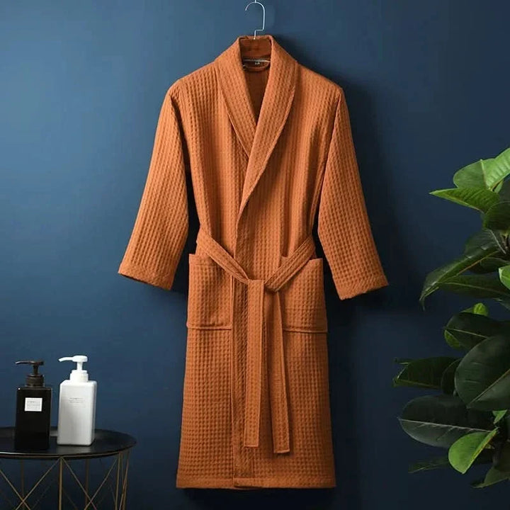 Person relaxing in comfortable unisex spa robe and sleepwear