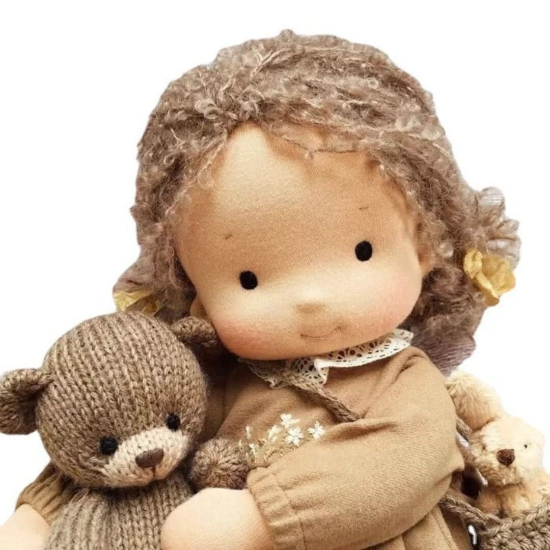 Organic Waldorf doll showing the back view of its handmade braided hair