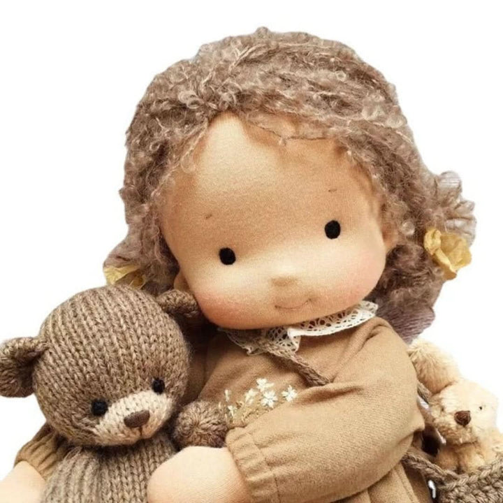 Organic Waldorf doll showing the back view of its handmade braided hair
