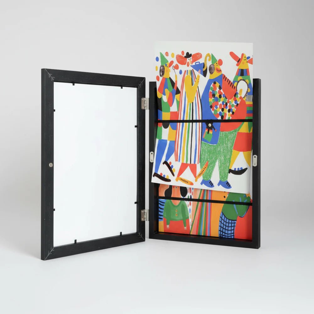 Open wall-mounted picture frame displaying children drawings on white background