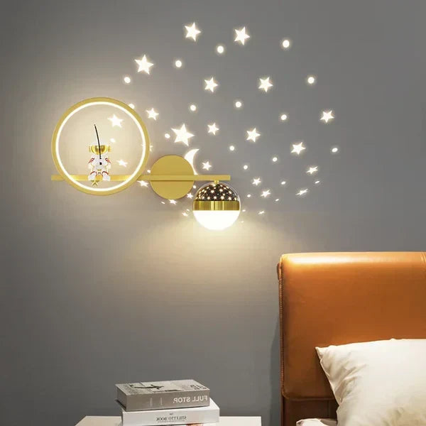 Children's astronaut wall lamp with starry night projection in a nursery
