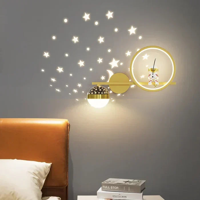 Nursery lighting astronaut wall sconce with ambient starry projection