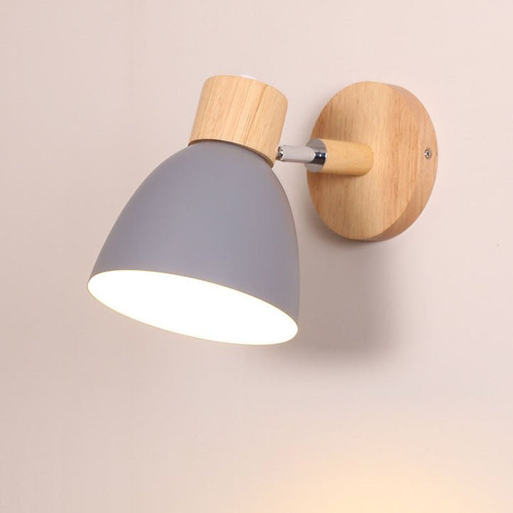Sleek metal and wood wall lamp suitable for modern living room decor