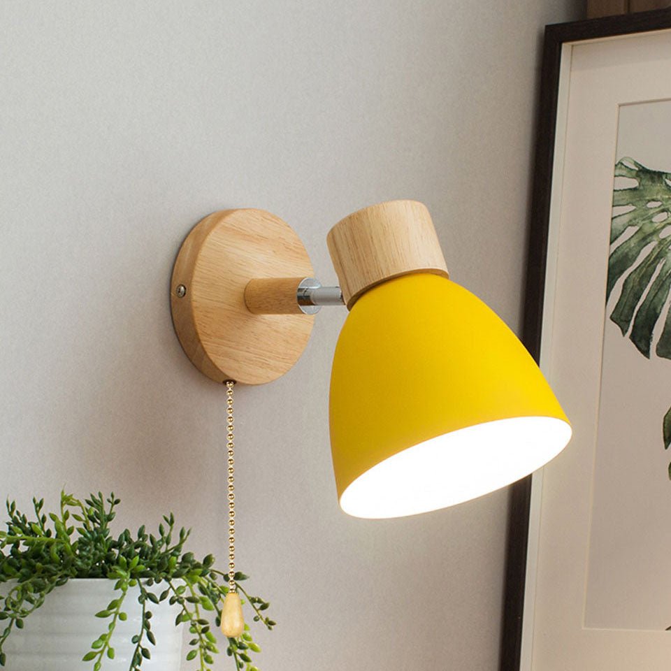 Modern wooden cone wall lamp casting warm glow in minimalist interior