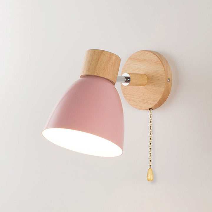 Close-up of conical wooden lampshade detail on modern wall sconce
