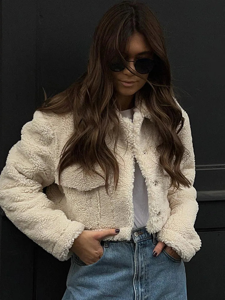 Woman wearing the Beige Lucia warm short winter coat outdoors